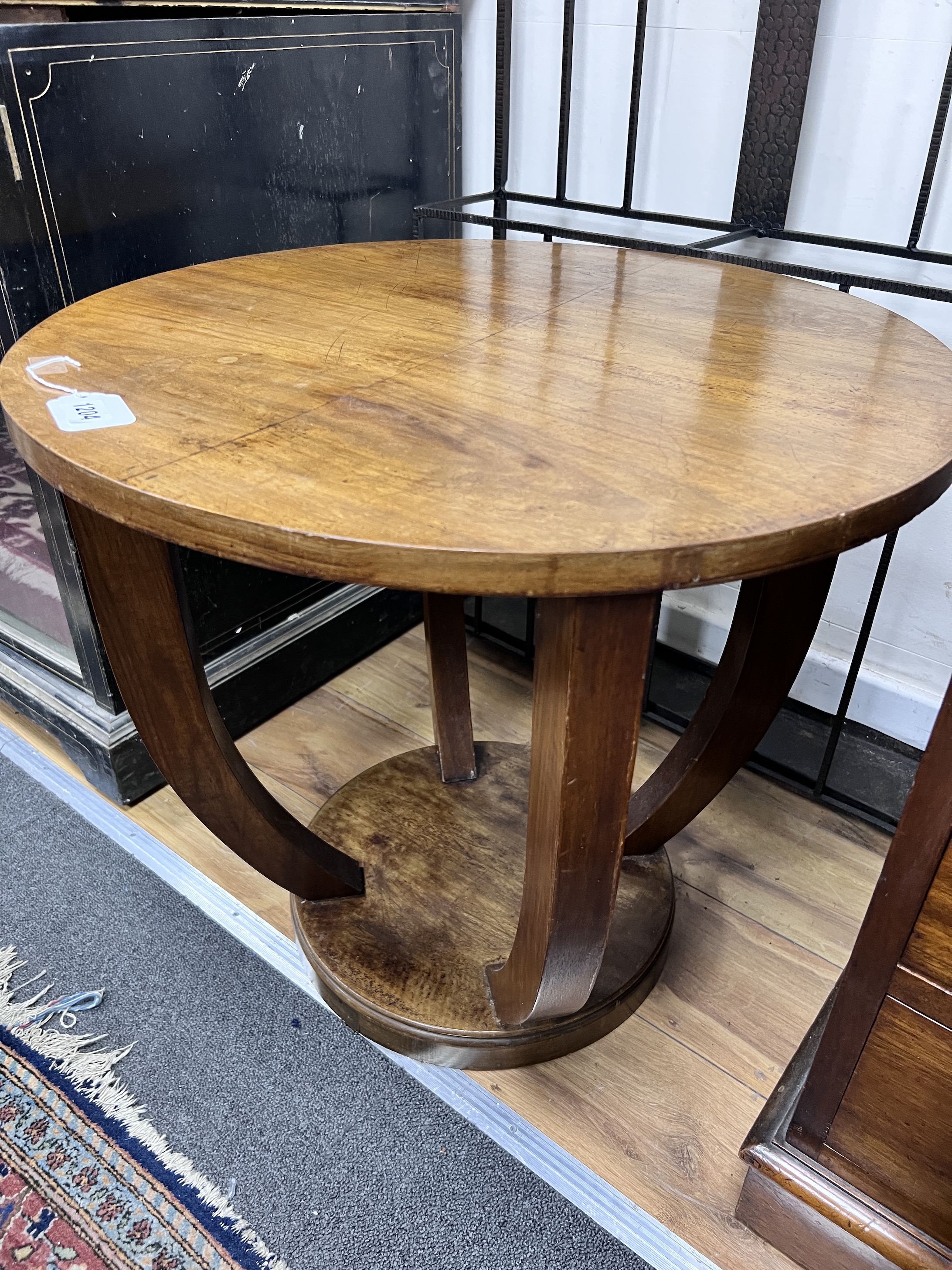 A French Art Deco walnut occasional table, diameter 59cm, height 56cm